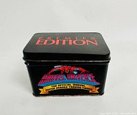 Closed black tin showing red ‘PREMIER EDITION’ on lid and Marvel Universe branding