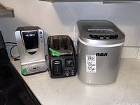 Full view of all three appliances on countertop: Mr. Coffee Keurig coffee maker, T-Fal toaster, RCA ice maker