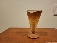 Full side view of novelty Italian glass vessel shaped like an ice cream cone, showing textured cone pattern and triangular top opening.