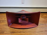 Front view of the red metal wide angle radial speaker driver showing the horn and central driver.