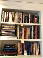 Bookshelves with about 56 books, a mix of hardcovers and paperbacks, mostly on U.S. Presidents and Connecticut history.