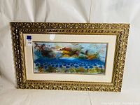Framed vintage artwork with gold ornate frame, showing full piece including blue poppies and abstract cityscape in vibrant colors.