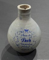 Front view of the small stoneware jug showing blue lettering 'Jack Amsterdam Holland' and crown emblem.