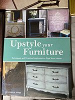 Front cover of 'Upstyle Your Furniture' showing painted furniture pieces and home decor inspiration.