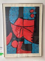 Full view of framed abstract red and blue print titled “Le Grand Zak”