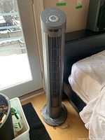 Front view of the Seville Classic tower fan, showing vertical grille and top control panel