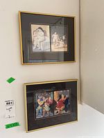 Two framed prints hanging on a wall, one large two-image Botero print with nude figures and one smaller colorful print showing several people.