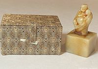Set showing carved Shoushan stone Buddha seal and decorative box side by side on white background.