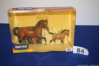Two Breyer Arabian model horses in original box, amber tone plastic window showing mare and foal inside.