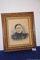 Full shot of the portrait in oak and gilt frame showing overall condition and design