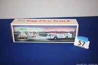 White Hess Toy Fire Truck Bank in original box showing front and side graphics.