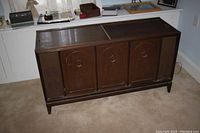 Full view of the wooden console cabinet showing the overall Mid-Century Modern style and dimensions.