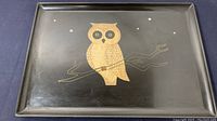 Full view of the black phenolic serving tray with an owl inlaid design sitting on a branch and surrounded by stars.