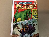 Front cover of Star Spangled War Stories #122 comic showing a green dinosaur attacking a vehicle with soldiers and dramatic text.