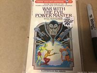 Front cover of the 1984 Choose Your Own Adventure book 'War With The Evil Power Master,' showing the illustrated characters and villain, the book number (37), and price tag.