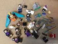 Overview of all LEGO minifigures and accessories laid out on a surface.