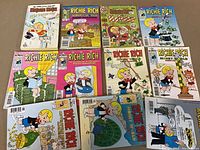 Photo showing eleven Richie Rich comic digest books arranged on a flat surface, displaying colorful cartoon covers with Richie Rich in various money and wealth-themed scenes.