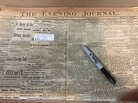 Front page of The Evening Journal newspaper folded, dated Monday August 1, 1887, showing ads and news articles.