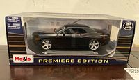 Front view of the Maisto 2006 Dodge Challenger Concept car model in original box.