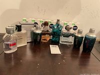Row of men’s colognes and Nivea Men boxed moisturizers on table