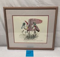 Framed lithograph depicting nesting spoonbill birds with chicks, signed by artist.