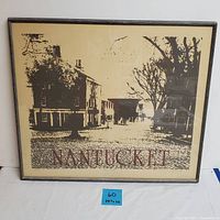 Full view of framed lithograph showing Nantucket street scene with "NANTUCKET" text, measuring approximately 28.5 x 26 inches.
