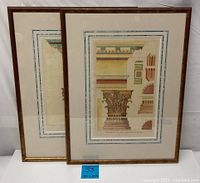 Two framed vintage lithograph architecture prints in wood frames with glass and mats, showing detailed classical column capitals and architectural elements.