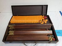 Open case showing tiles and racks inside