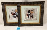 Two framed abstract mid-century modern lithographs placed side by side showing full view of lot