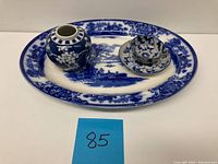 Blue and white Chinese plum blossoms vase, demitasse cup and saucer, placed on Grindley English transferware platter.