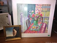 Overall view showing two framed artworks: large watercolor and smaller portrait