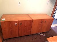 Front view of two-section cabinet showing four doors and chrome handles