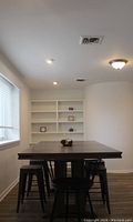 Rectangular dining table with 4 seats in corner room