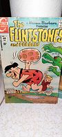 Front cover of The Flintstones and Pebbles comic book, showing title, characters, and publishing details