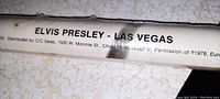 Close-up of the corner showing the text 'ELVIS PRESLEY - LAS VEGAS', copyright info, and distribution info from 1975, confirming vintage date and factory details.