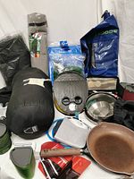 Photo showing the full collection including sleeping bag, dry bag, cooking pots, stove, utensils and pouches