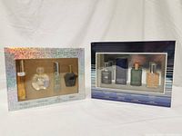 Photo of two perfume and cologne sets in original packaging: one from Elizabeth Arden and one from Preferred