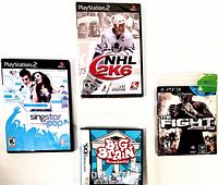 Four video games front covers, NHL 2K6, Singstar Pop, The Fight Lights Out, Big Brain Academy