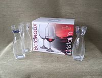 Box containing 6 Bohemia Cristallin Bordeaux wine glasses showing packaging with product image and branding.