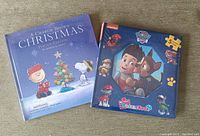 Photo of both books side-by-side showing their sealed packaging and covers.