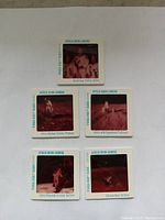 Five vintage 2x2 slides featuring Apollo Moon Landing scenes arranged on a white background