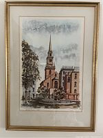 Framed watercolor painting of Old North Church in Boston, showing church steeple and trees in muted colors, gold-tone frame.