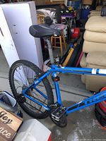 Side view of blue Trek mountain bike showing frame and saddle