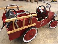 Right rear three-quarter view showing side, seat, wheel