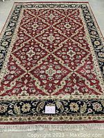 Overhead view of full rug laid flat on concrete floor