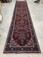 Full-length vertical view of runner laid flat on concrete floor