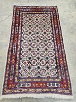 Full view of rectangular rug on concrete floor