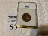 2002 S Indiana state quarter in protective graded plastic case, label visible with PR70 DCAM grade by MGC.