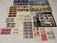 Full layout of various stamp sheets and blocks including classic movie monsters, wildlife, and historic figures.