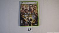 Front cover of the sealed Xbox 360 game 'WWE Legends of WrestleMania' showing the box art with multiple wrestlers.